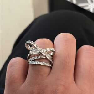 Intricate Silver Crisscross Bow Ring with Sparkling Stones
